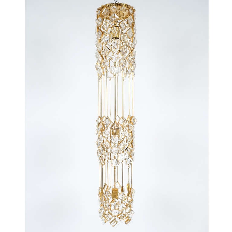 Column style chandelier (flush ceiling light), Palwa 1970

Delicate and rare column style ceiling light by Palwa, Germany. This fixture has been handcrafted and has a drop of almost 50 inches. It consists of gilded brass chains with glass crystals