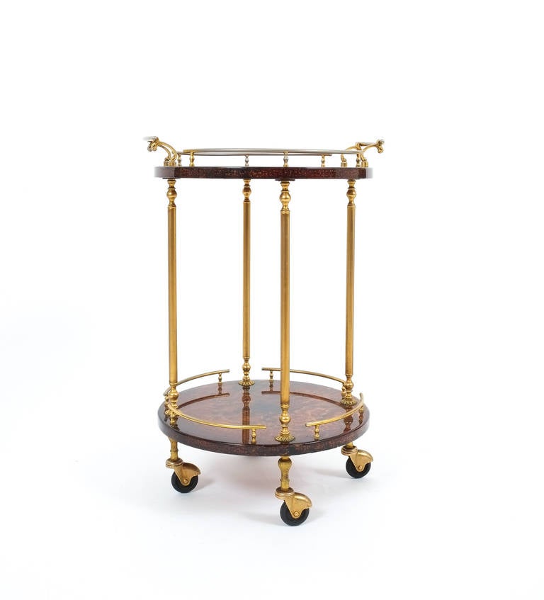 Rare petit  liquor or bar cart by Aldo Tura Milan, Italy.
It's composed of two dyed (mahagany) and lacquered goatskin traces and polished brass hardware and it's in very good condition.

Shipping is complimentary.