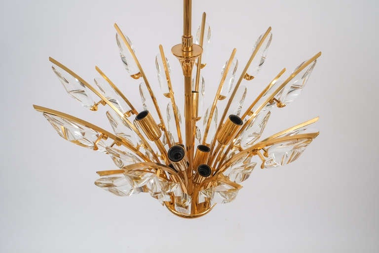 Gorgeous italian crystal chandelier. Gold plated brass branches and unique geometrical crystals. It has been professionally cleaned and polished.