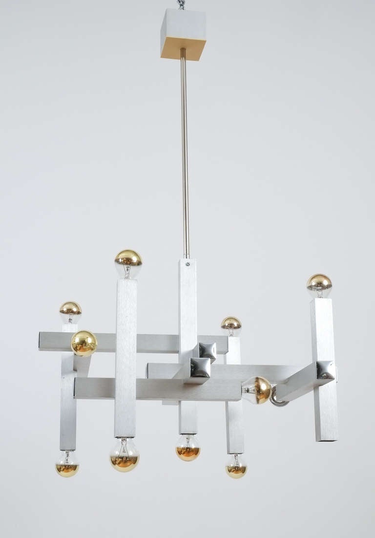 Cool architectural chandelier by Gaetano Sciolari in the shape of a vintage contemporary superstructure. The fixture has been professionally cleaned.
It holds 12 bulbs with 40W each (480W).