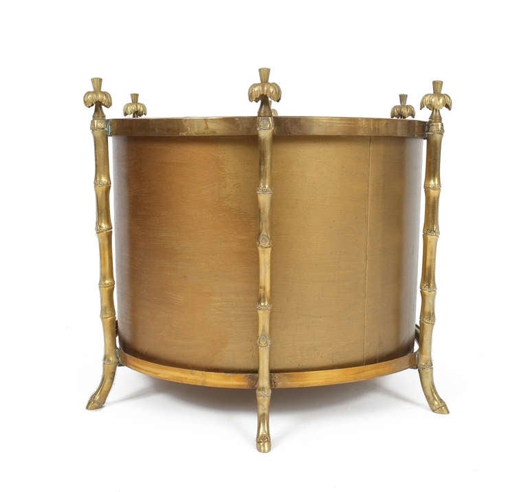 Stunning french jardiniere from the 19th century. Beautifully executed solid brass faux-wood legs with whimsical satyr feet and palmtree-tops- very rich in detail.
The cylindrical actual metal planting pot is detachable and painted golden in