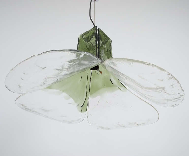 Beautiful petal light by Carlo Nason for Mazzega/Italy. The thick smooth textured glass changes gradually from clear glass to green glass. It's in excellent condition and adjustable in height.