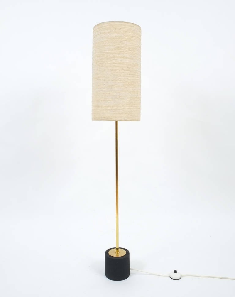 Beautiful and rare 'Kilo' floor lamp by Kalmar, Austria, 1950. The design of the light literally translates a 'kilogram' weight into the cast iron base of the lamp. The base shows some chips, otherwise in very good condition. The light and shade are