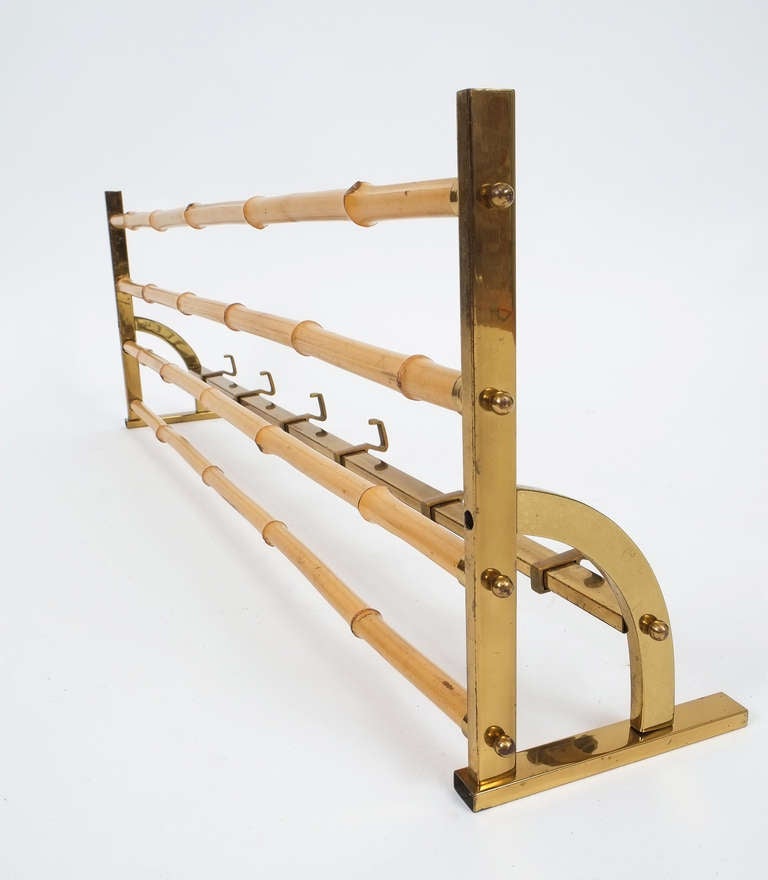 Beautiful 1950's bamboo & brass coat rack in good condition.