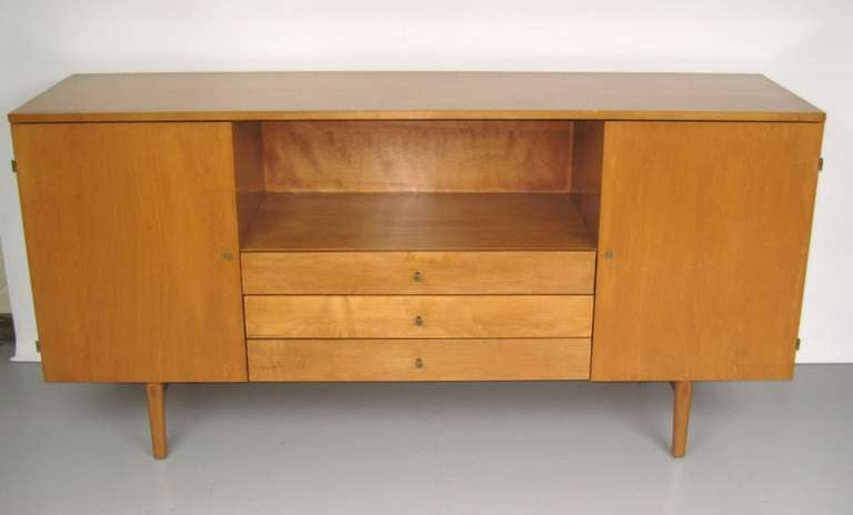 Sleek lines on this Paul Mccobb credenza.  Great mid-century modern style. 
100% Original Finish. Additional pieces are listed as well.