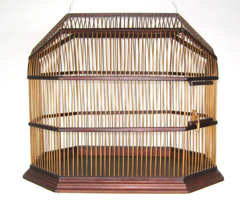 Stunning Mid Century Modern Walnut Bird Cage. 
All lap jointed, Continuous Bamboo running throughout 
Slide out bottom tray