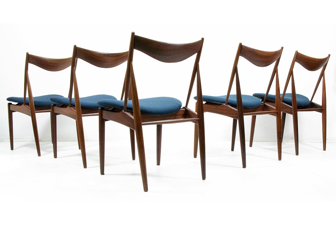 A set of five 1960s dining chairs by Kurt Ostervig for Bramin.

The sculpted walnut backs, floating seats and angled legs are reminiscent of Finn Juhl's finest designs.

Produced in the 1960s in walnut this set is in good structural condition.