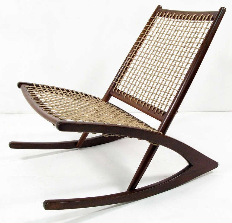 An amazing geometric rocking chair by Norwegian designer Fredrik Kayser for Vatne Mobler. Designed in the late fifties, in our opinion it is amongst the finest rocking chairs ever conceived.

In solid dark afromosia wood, repolished and newly