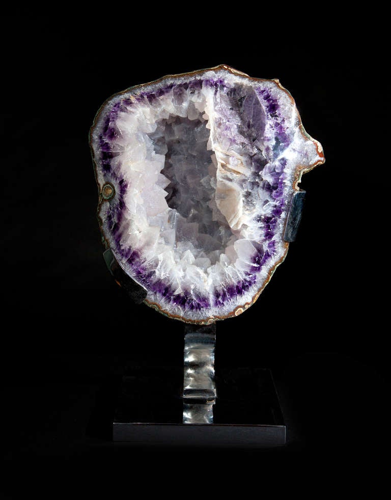 Amethyst Crystal cluster on custom made steel base.

- - -

About Dale Rogers

Since 1986 Dale has been sourcing the most unique fossils and minerals from around the world and through his company Dale Rogers Ammonite has been supplying leading