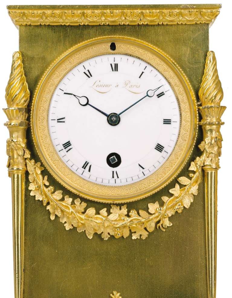 A French Empire Gilt Bronze and Porphyry Calendar Desk Clock, Lesieur à Paris, Circa 1810