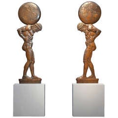 An imposing pair of bronze high relief wall decorations, circa 1925
