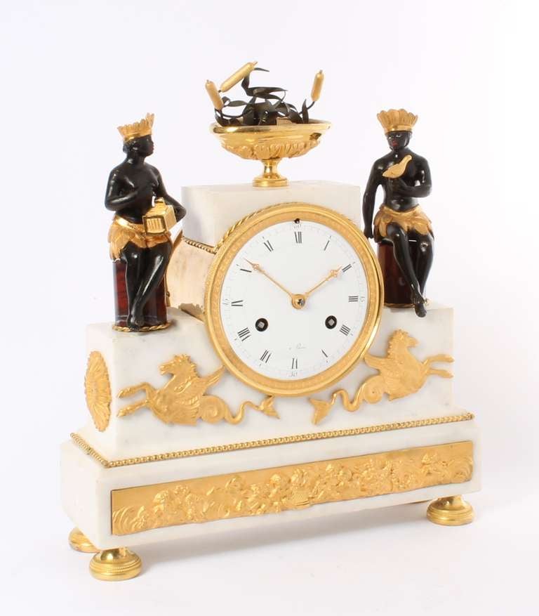 10-cm enamel dial with Roman numerals signed 'à Paris' and engraved gilt bronze hands, 8-day spring driven movement with anchor escapement and silk suspended pendulum, countwheel half hour striking on a bell, white marble case with fine ormolu