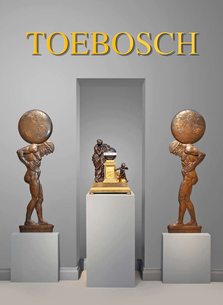 An imposing pair of bronze high relief wall decorations, circa 1925