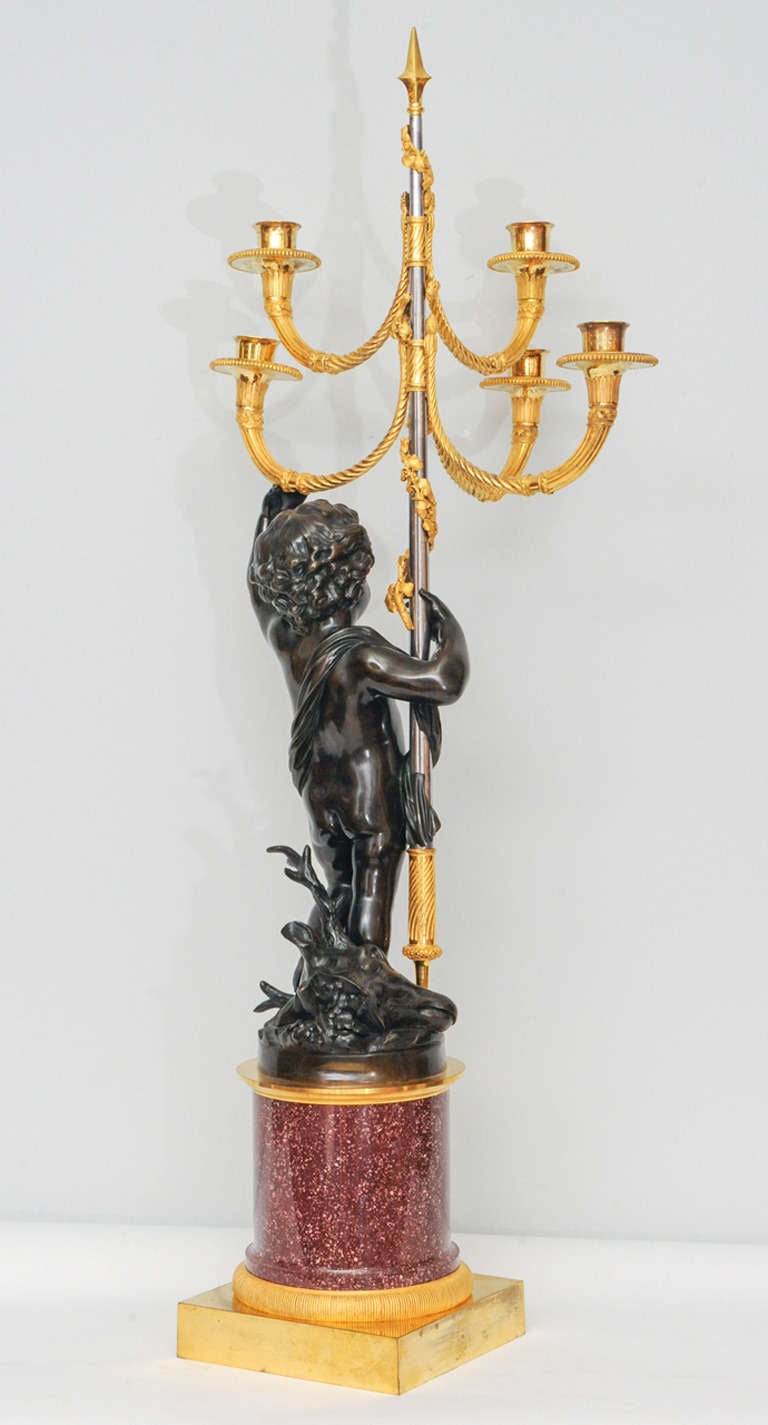 Empire A pair of French gilt and patinated bronze 5-light candelabra on porphyry base
