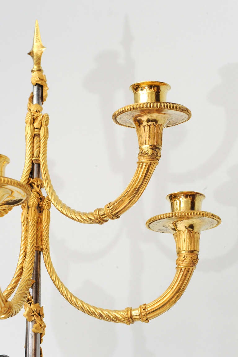 A pair of French gilt and patinated bronze 5-light candelabra on porphyry base 1