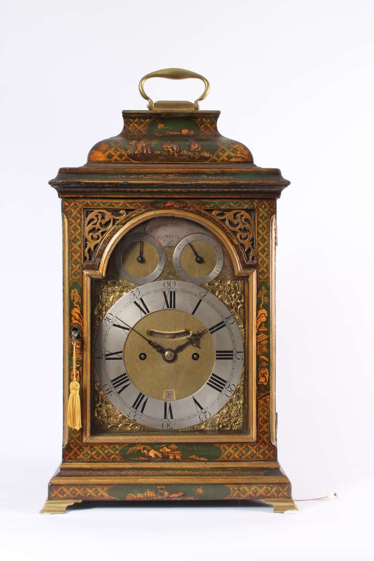 This Georgian green lacquered and chinoiserie bracket clock with a shallow inverted bell top is signed 'Conyers Dunlop' (1725-1779) . The broken arch dial has cast spandrels and silvered and nicely engraved chapters which include both fast/slow and