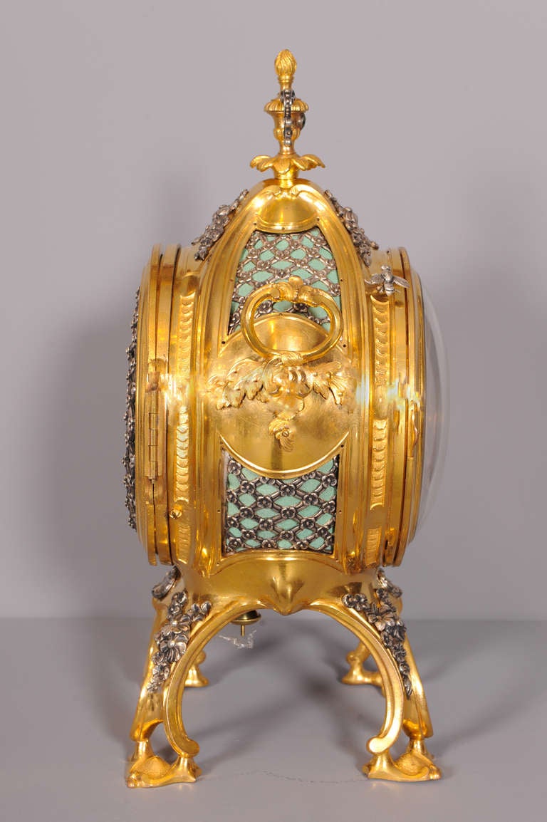 An Important English Ormolu and Silver Pendulum Clock With 'Grand Sonnerie', Stephen Rimbault, Circa 1765

Case: firegilt bronze with silver applications, on four volute feet with flower and rocaille ornaments. The sides are open-worked with