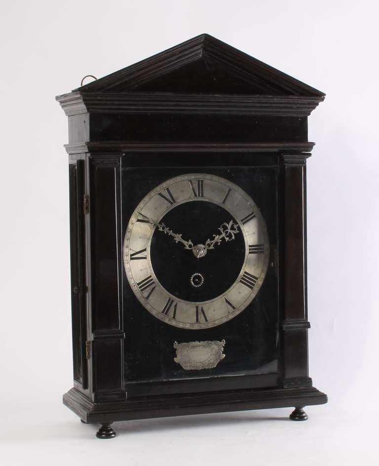 An Early Dutch Ebony And Silvered Table Clock, So-called 'hague Clock', By Christiaan Reynaert Hague, Circa 1670

Dial: brass dial plate, 23.5 x 18.5 cm., covered with later black velvet and turning on hinges; silvered chapter ring (minute