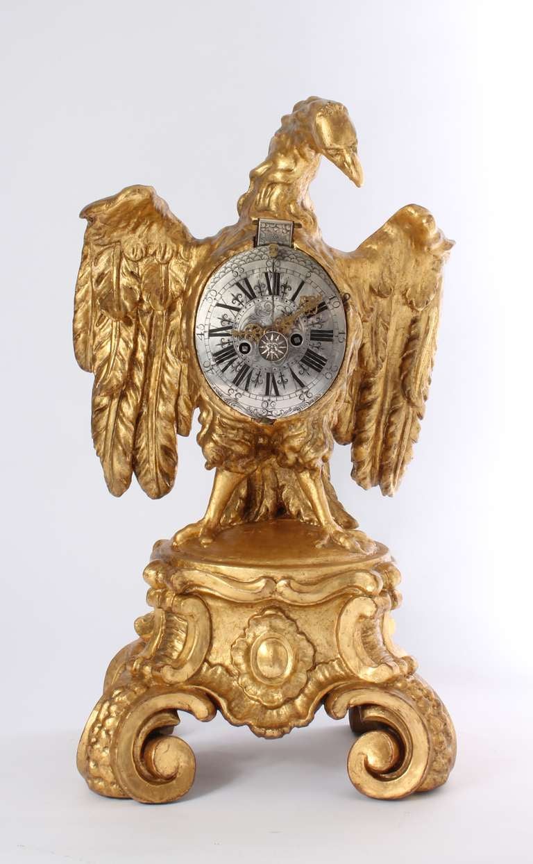 A Decorative South German Parcel Gilt Sculptural Table Clock, Circa 1730