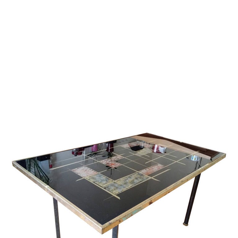 Table top in eglomise glass, brass rim, black lacquered steel, brass feet
this table is currently in Paris France , can be shipped by air or sea freight, please ask us about shipping options
