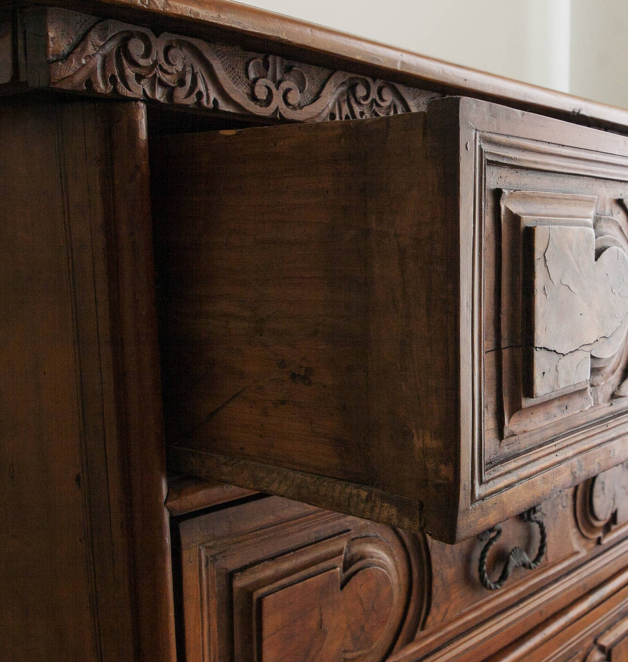 Beautiful heavily carved chest with three long drawers, carved feet and trim.