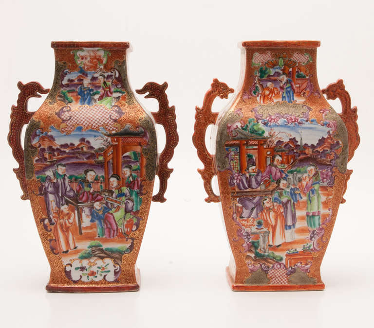 This is an exceptional set of a beautiful garniture set of four Chinese export porcelain Rouge-De-Fer mandarin palette vases, Qianlong, circa 1785. The set is very well painted in the mandarin palette with Chinese domestic scenes in the panels with