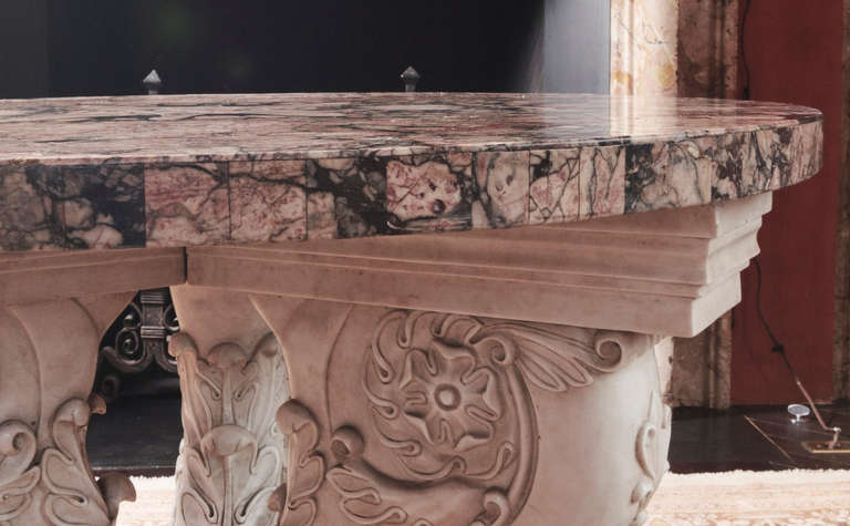 This beautiful 18th century Italian marble center table would make a statement piece in any room of your choosing. The bottom is carved Carrera marble in the shape of a lion's foot. It also has a pretty floral engraving on the bottom side of the