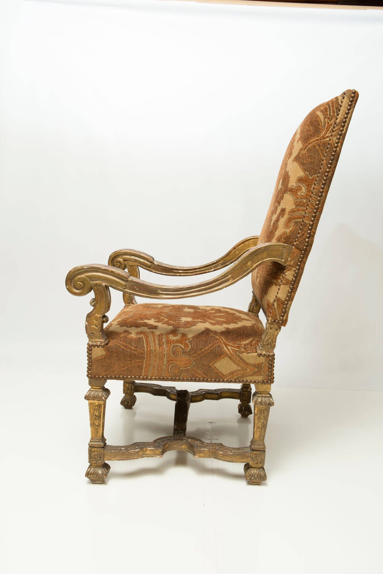Louis XIV Style Carved Giltwood Armchair, 19th century with nail head trim.