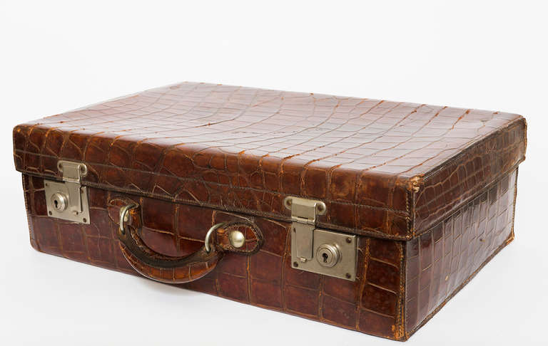 A 19th Century beautiful alligator valise or travel case with leather lining and brass hardware.