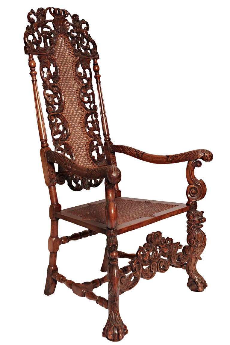 Beautifully carved James II walnut chair of superb quality.  The back and seat are hand caned.