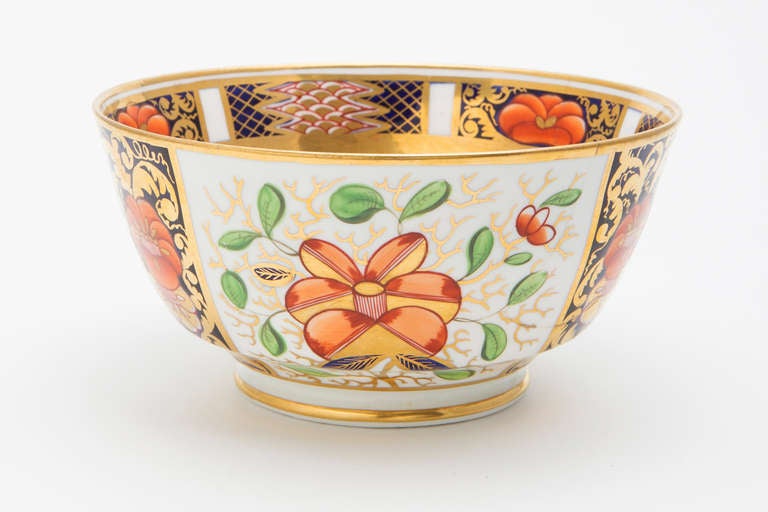 Minton china waste bowl used in a tea set with navy, green, orange and gold. Note in pictures that it has been cracked but repaired.