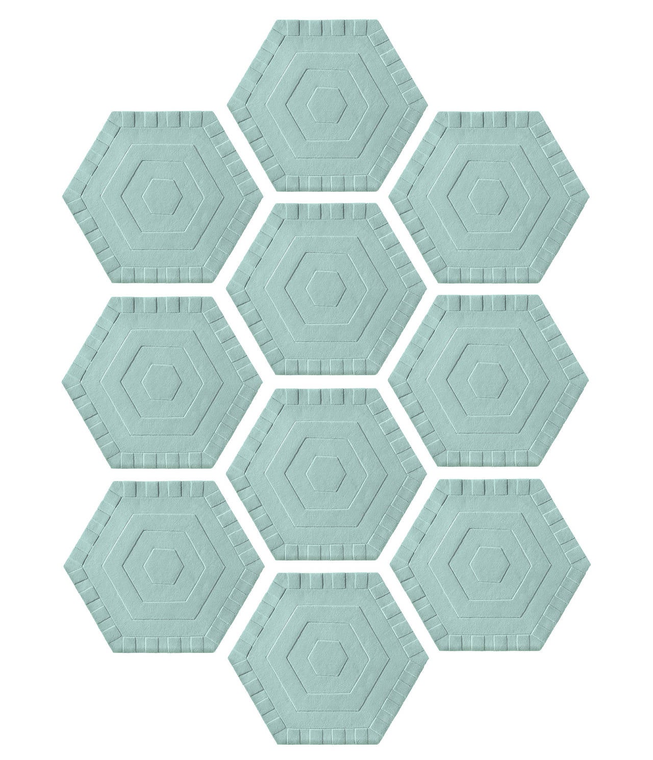 Kinder ground is a modular rug system defined by unconventional shapes hexagons, triangles, and diamonds, that fit together seamlessly. Each piece is fashioned from 100% New Zealand wool, with a non-slip tree rubber and jute backing that eliminates