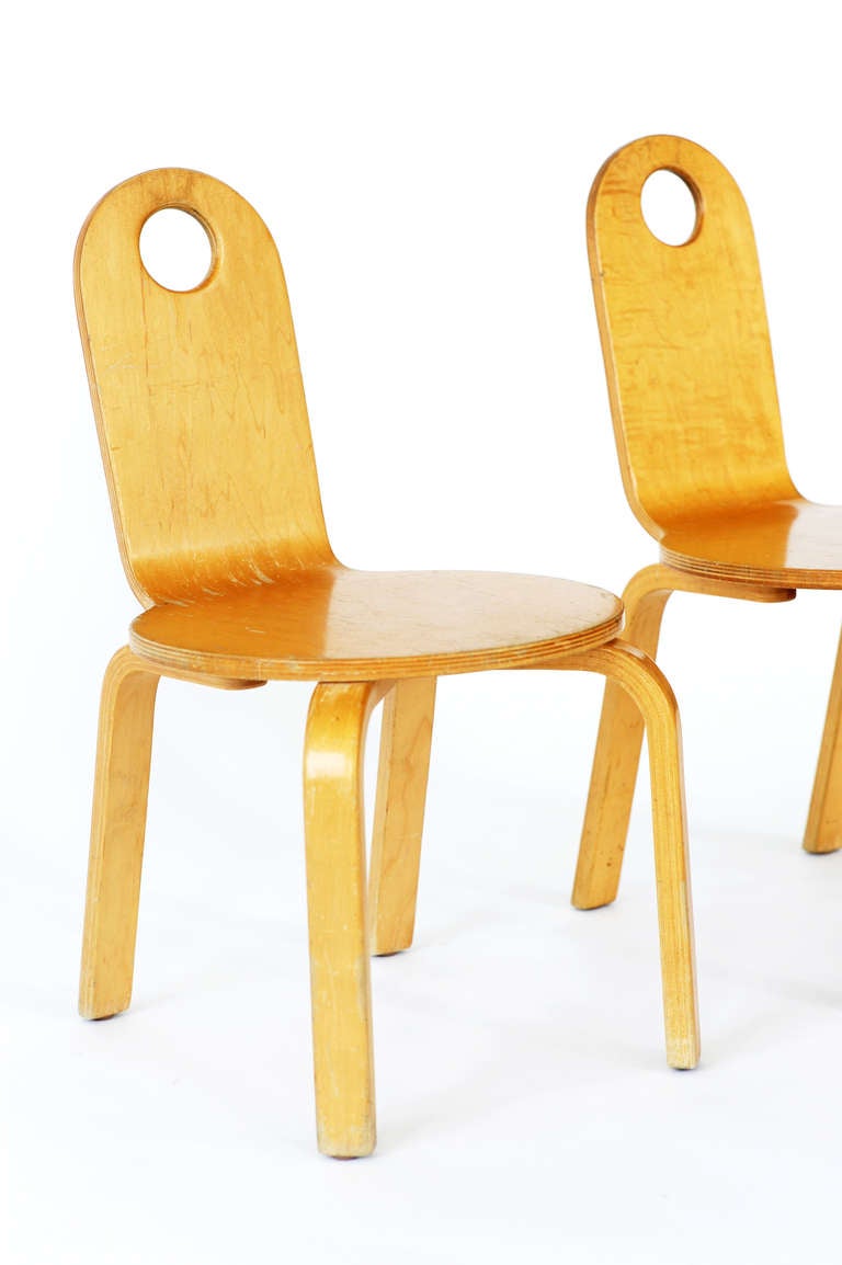 Pair of two Thonet bentwood children's chairs with cut out dot in the oval backs. Blonde plywood finish. 
Stamped Thonet