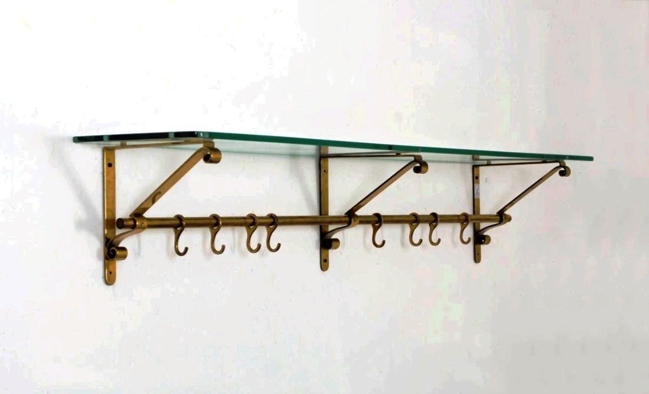 Rare wall coat hanger with a glass shelf by Fontana Arte wit a metal label S.A.L.F Luigi Fontana Milano

Many pieces are stored in our warehouse, so please click CONTACT DEALER under our logo to find out if the pieces you are interested in seeing