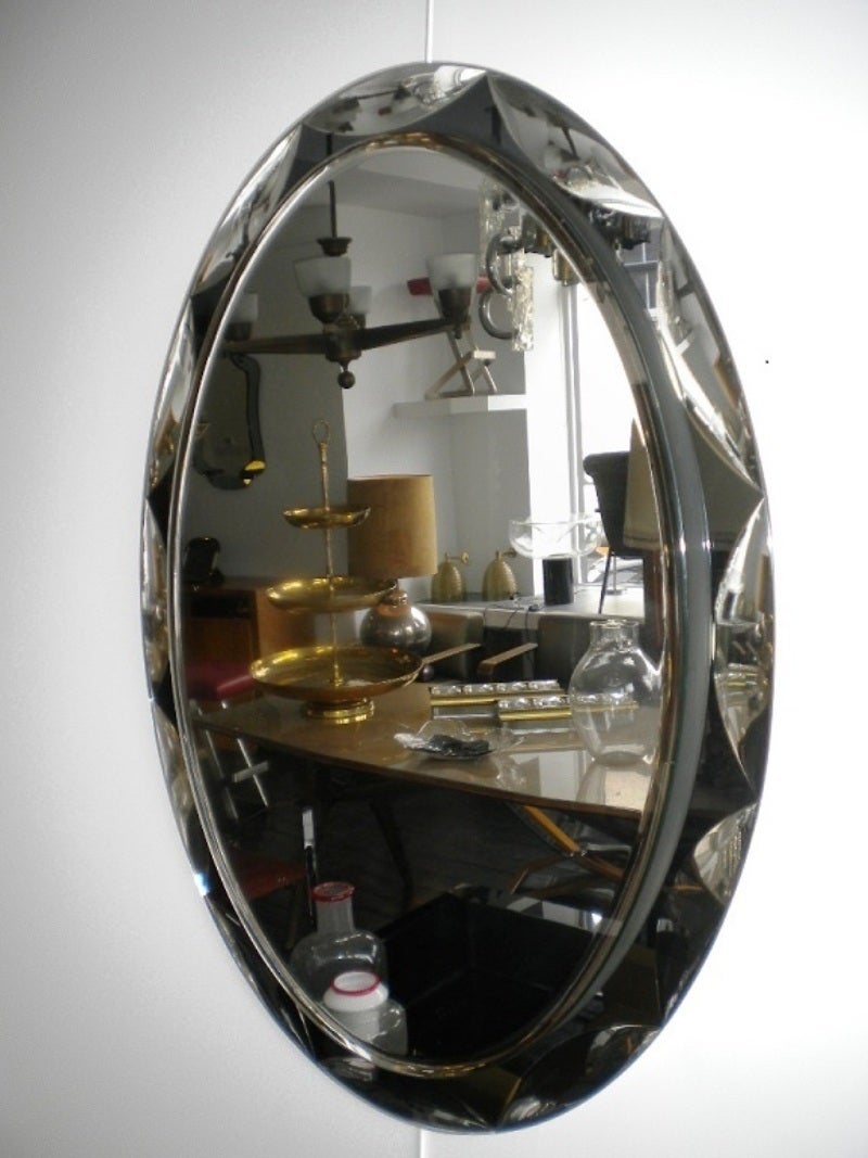 Stunning original 1950s black bevelled oval mirror.