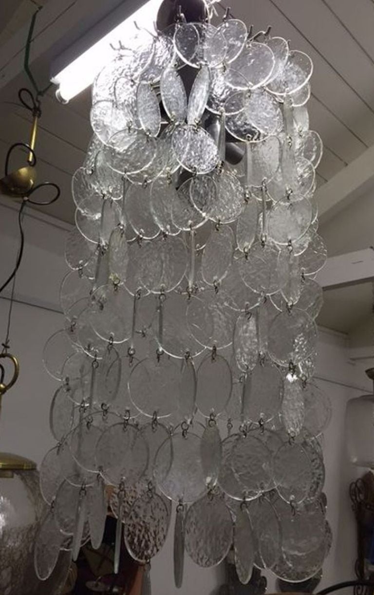 Ceiling light with glass discs forming a cascade of waffles glass.