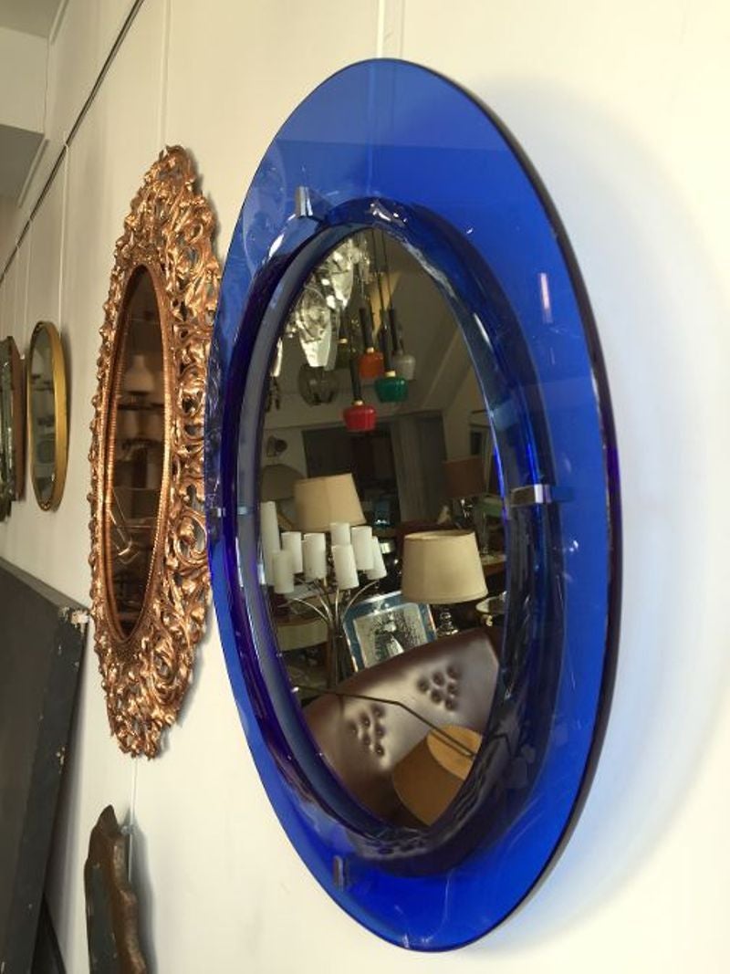 Amazing early 1960s blue round mirror.