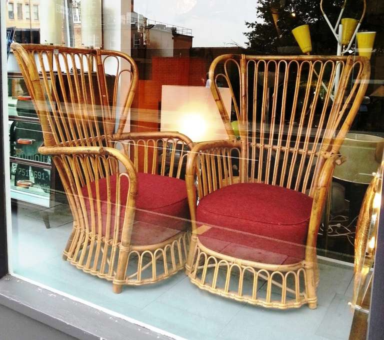 Wicker chairs with an elegant movement and a higher back; an example of fine 1950s Italian design.