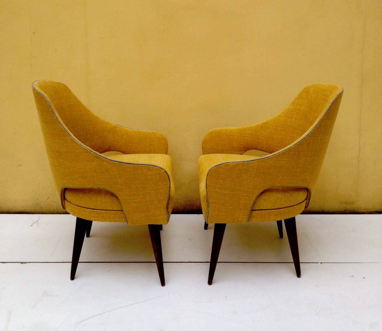 Elegant pair of small armchairs, refined details and newly recovered with a Colefax and Fowler fabric.