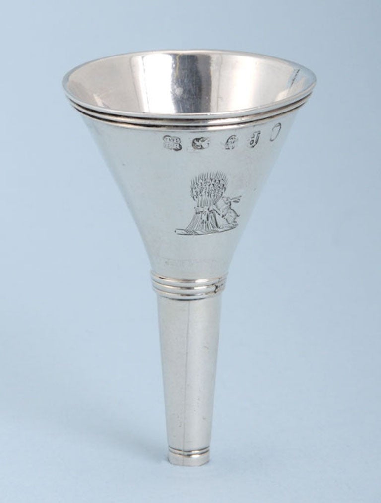 Very simple George III small sterling silver spirit funnel. Made in London by Thomas Phipps and Edward Robinson II. The funnel has a band of reeding at the top and is engraved with a contemporary family crest. It is stamped with the full set of