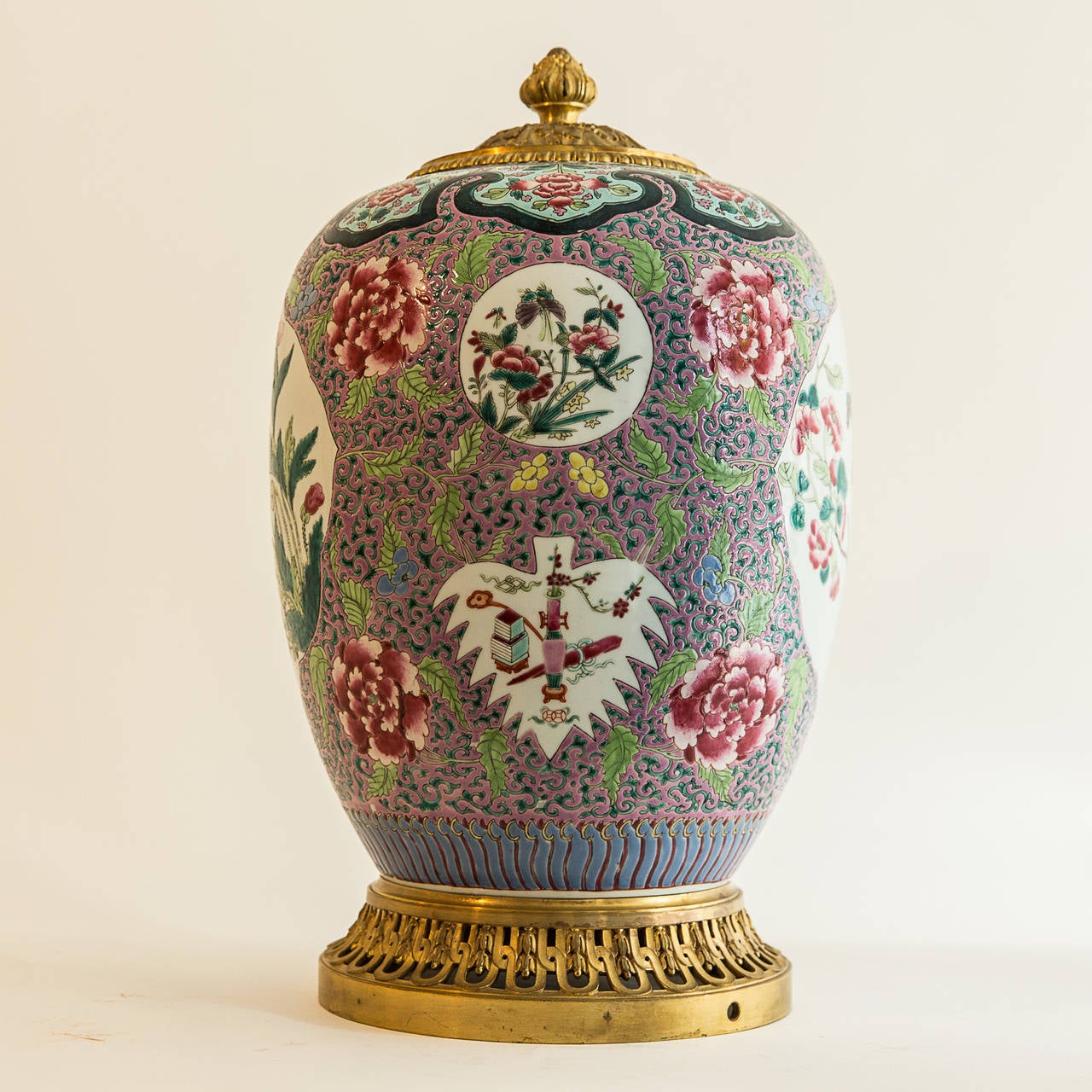 A very fine 19th century Famille rose vase with intricate pattern and medallions including peonies flowers. Gilt bronze mounted. A good example of early 19th century Chinese export porcelain