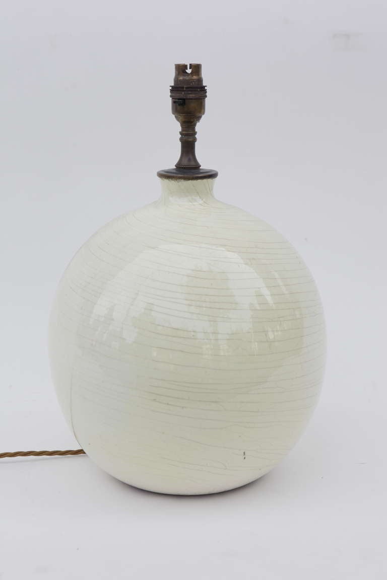 An exquisite ceramic table lamp by Jean Besnard (France circa 1930) white with an unusual pale yellow glaze. Note that Jean Besnard was the man who designed lamps for Ruhlmann at the time.