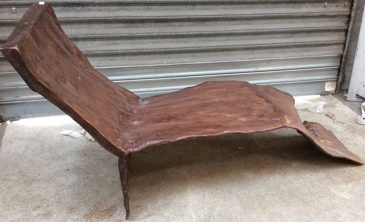 Very sculptural 19th century root lounge chair with brown patina.