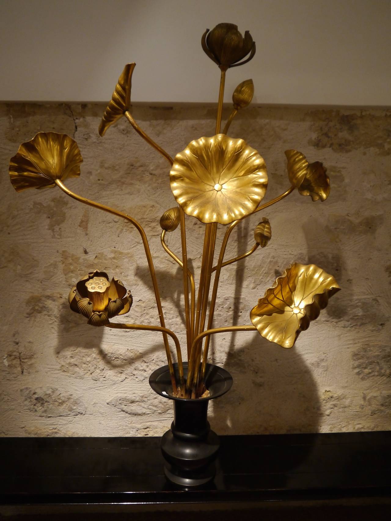 Pair of metal vases contains 20 carved lacquered giltwood altar flowers. Lotus leaves and flowers symbolize the various stages of life.
Various size : tallest H : 120 cm wide 13 cm - smallest H: 45 cm wide: 35 cm.