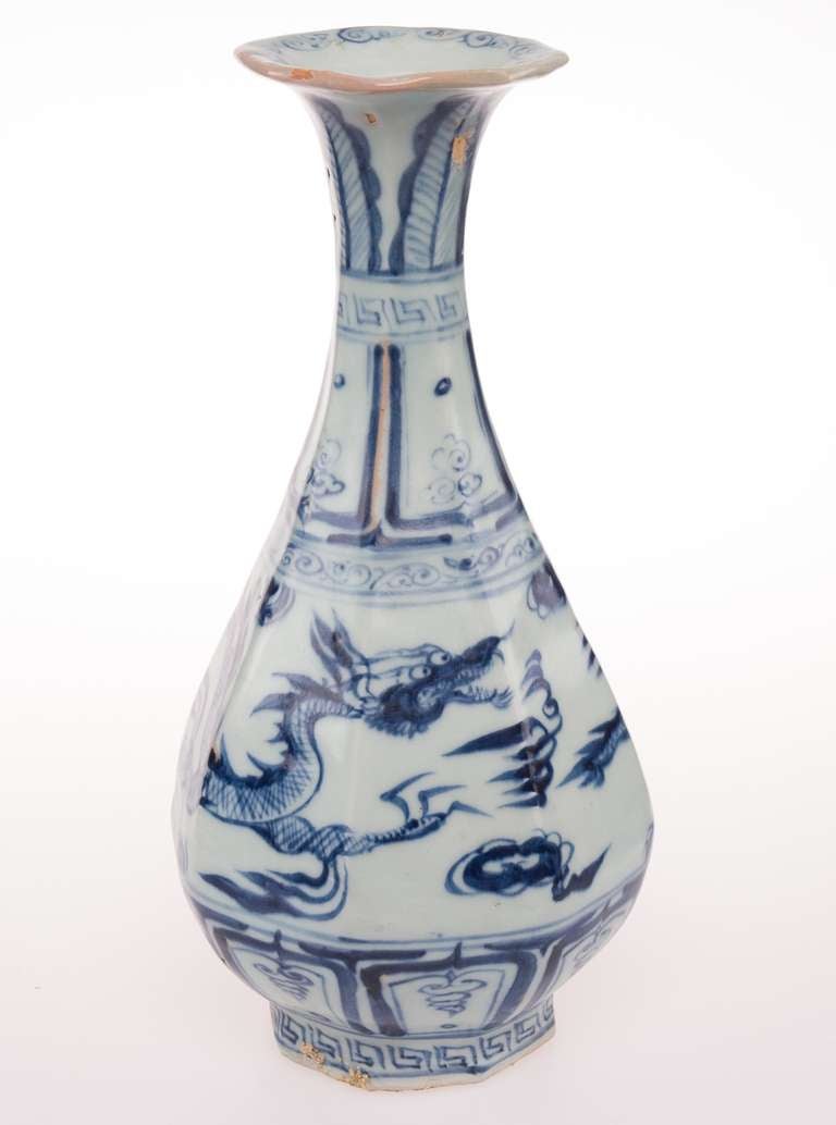 An octagonal porcelain vase with Yuan characteristics with the little head of a dragon, a thin body with a three-claw paw.