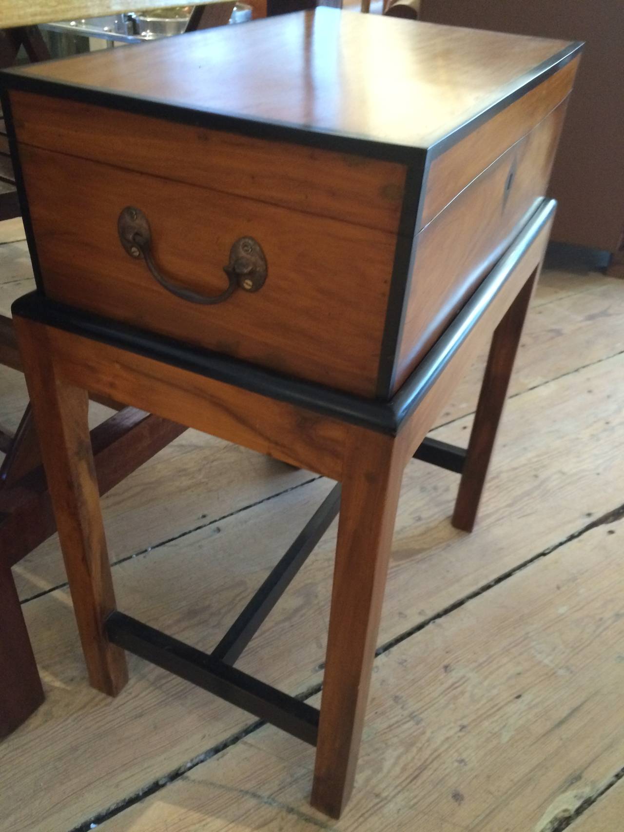 Late 19th c. British Campaign officer's chest on a custom made stand.  Both made of exotic and rare hardwoods, satinwood and ebony.  Refinished.  Brass handles

British Campaign Antiques.  Shop located on Nantucket Island.