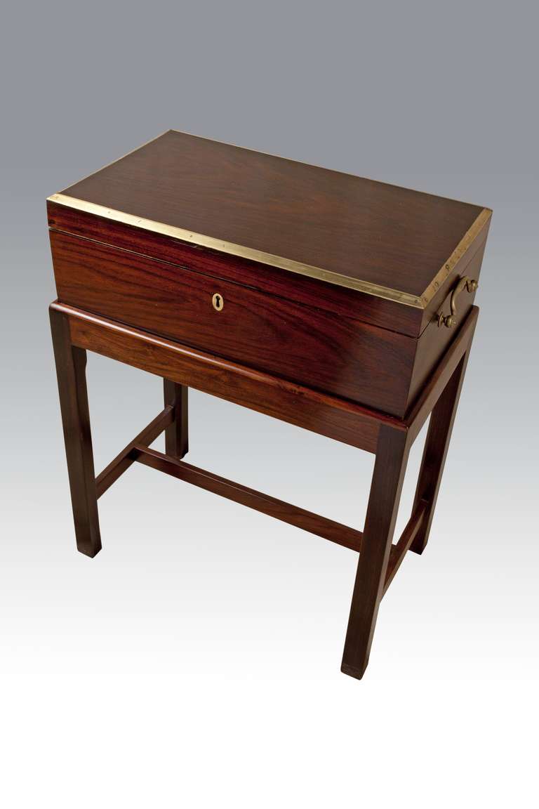 A beautiful rich rosewood British campaign officer's chest with simple brass trims and handles, and fitted interior with writing surface. These were used as the personal effects box for an officer who would then be stationed all over the world. This