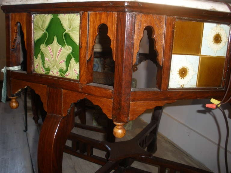 Unusual Arts and Crafts center table with English tiles and beveled marble top. Designed in an octagonal shape.