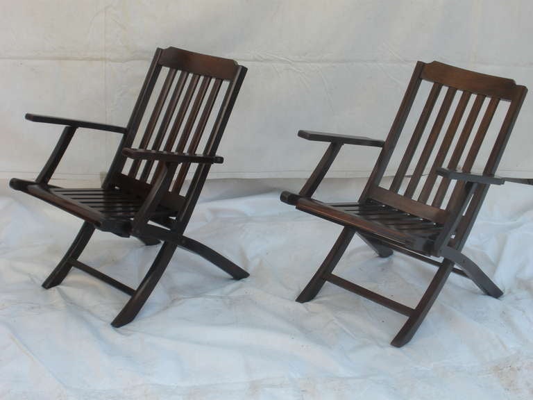 Pair of refinished folding rosewood chairs from 1920's British steamer ship.  Great lines and comfortable.