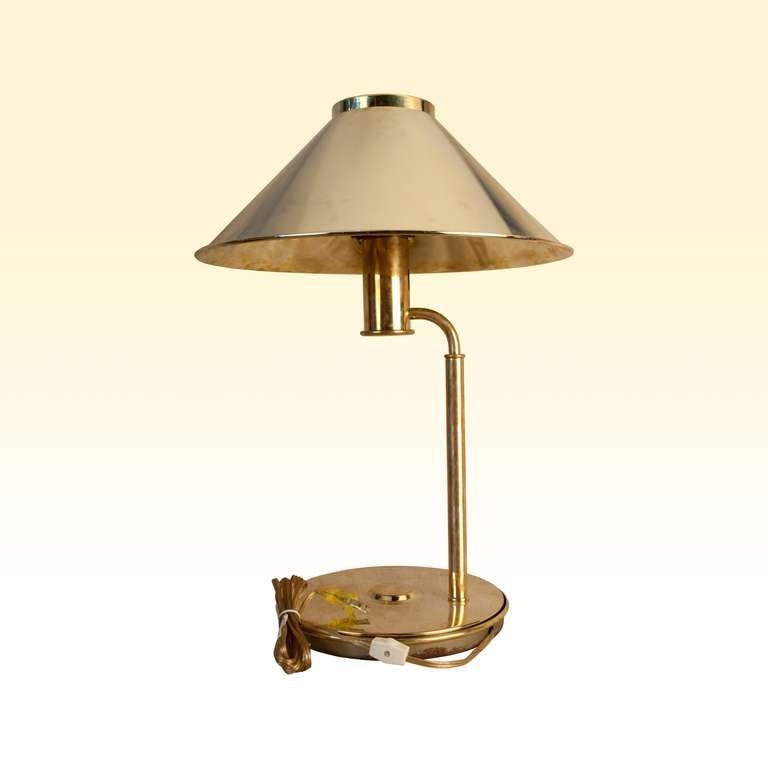 Pair of nautical brass ship's table lamps from the 1960's.  The shade lifts off and the lamps have been rewired for American use and takes one regular size light bulb